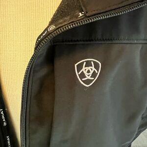 Ariat black vest with white stitching